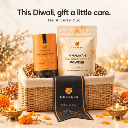 Cherker Tea and Berry Diwali duo gift basket with sea buckthorn herbal tea tin, Himalayan sea buckthorn powder pouch, cream cloth and dried flowers